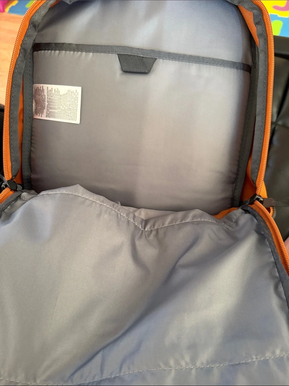 The North Face Jester Backpack in burnt orange with black accents